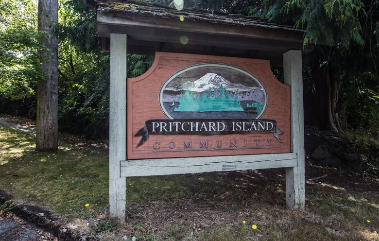 A sign marks the entrance to the Pritchard Island community in Rainier Beach.  (Steve Ringman/The Seattle Times)