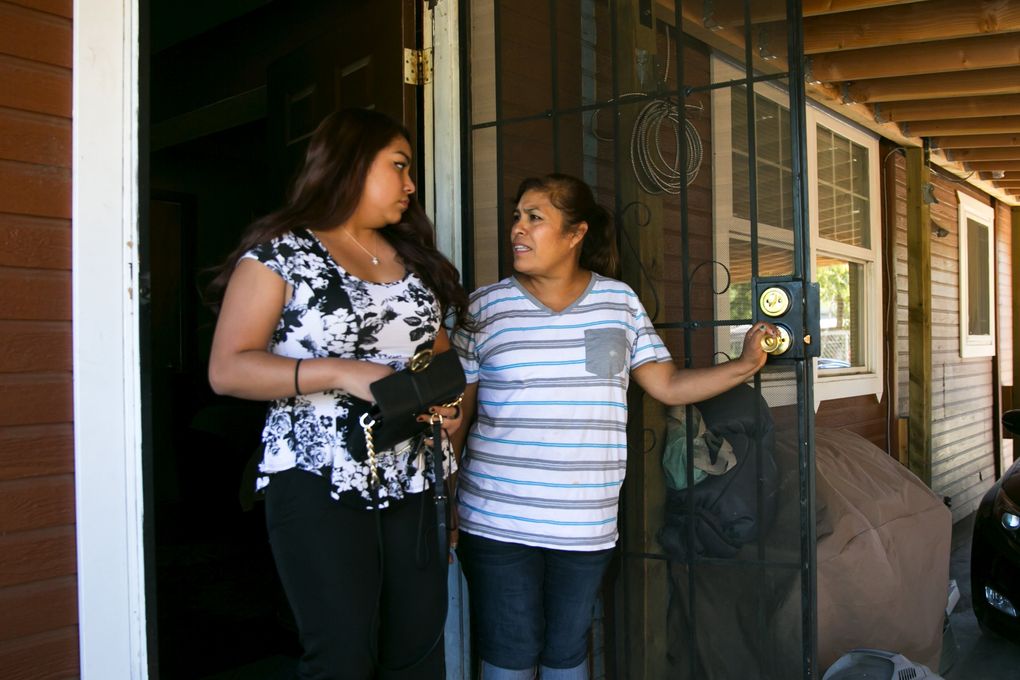 Yulissa Martínez, 19, says goodbye to her mother, Juana, outside their house in southeast Yakima. The youngest of five siblings, Martínez has taken interest in politics, inspiring her family to become politically active as well. Her parents crossed the border from Mexico as young adults to work in fruit farms and warehouses, and recently became U.S. citizens. “My whole family — not even just my parents — they have gone through struggles to become successful,” she said. “It’s important to vote.” (Bettina Hansen/The Seattle Times)