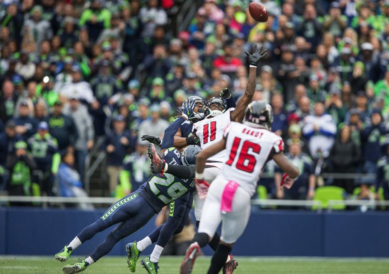 Falcons' Julio Jones hobbled, but gets best of Sherman