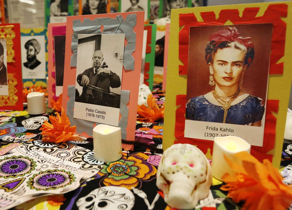 Mexican artist Frida Kahlo and Spanish musician Pablo Casals are among those honored by this display at a Día de Muertos celebration at Seattle Center Armory in 2014. (Alan Berner / The Seattle Times)