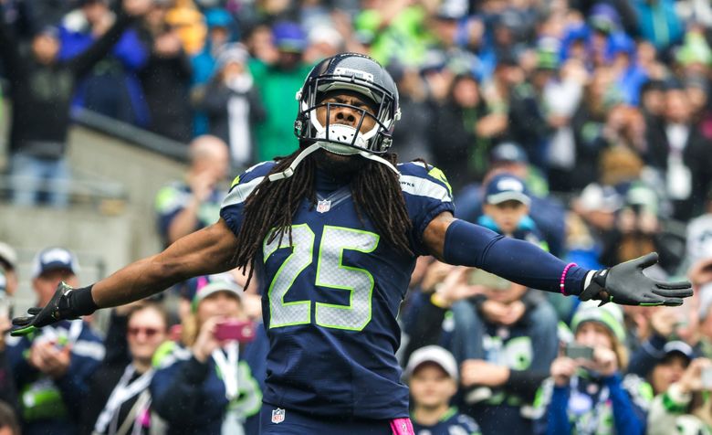 Seattle Seahawks cornerback Richard Sherman (25) gets looked over