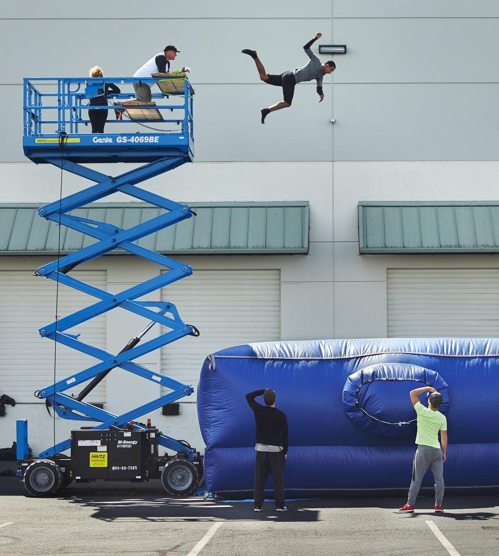 Crash course: Diego Davila-Rivera practices a high fall. (Benjamin Benschneider/The Seattle Times)