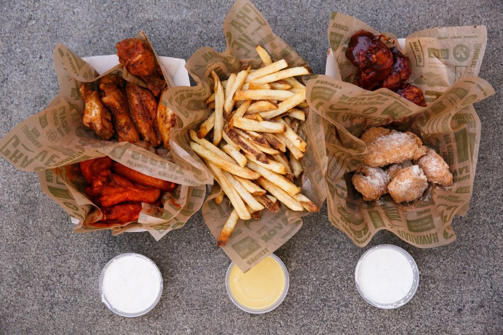 The wings at Richard Sherman’s Wingstop come in classic or boneless, an array of wing packages and many different flavors. His favorites: garlic parmesan and teriyaki. (Erika Schultz/The Seattle Times)