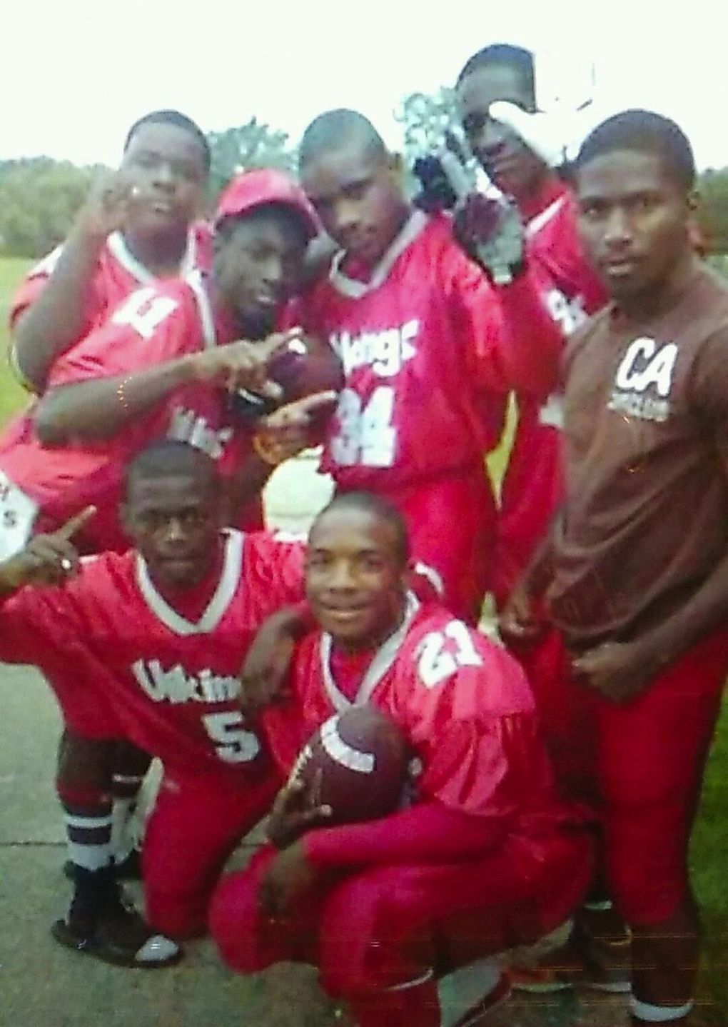 Thomas “Ty” Rawls, center (34), and his brother Thomas “Rell” Rawls, bottom (21), while they played football with the Vikings of Flint Northern High School. (Photo courtesy Deadra Whitley)