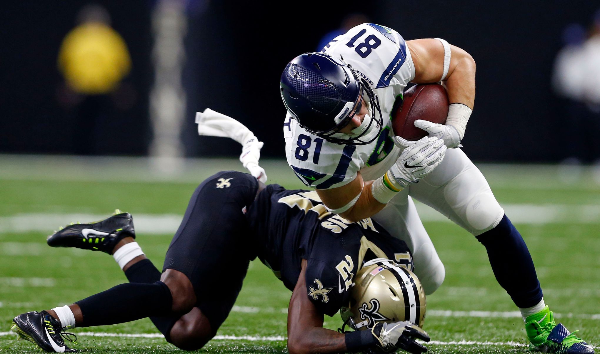 Seattle Seahawks tight end Nick Vannett (81) is stopped by New Orleans  Saints cornerback De'Vante Harris (21) in the second half of an NFL  football game in New Orleans, Sunday, Oct. 30