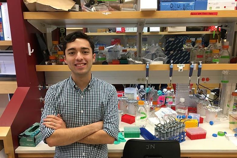 M.D.-Ph.D. student Alec Gibson spends a lot of time in the lab — and in reaching out to medically underserved communities. (Photo provided by UW School of Medicine)