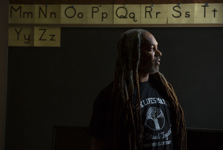 DeShawn Jackson is a teacher at John Muir Elementary in Seattle. The school was inundated with hateful messages after conservative news outlets posted stories about the school’s teachers planning to wear Black Lives Matter shirts during an event to present black men in a positive light. The teachers say they wanted the event to focus on students, rather than serve as a political message.  (Bettina Hansen/The Seattle Times)