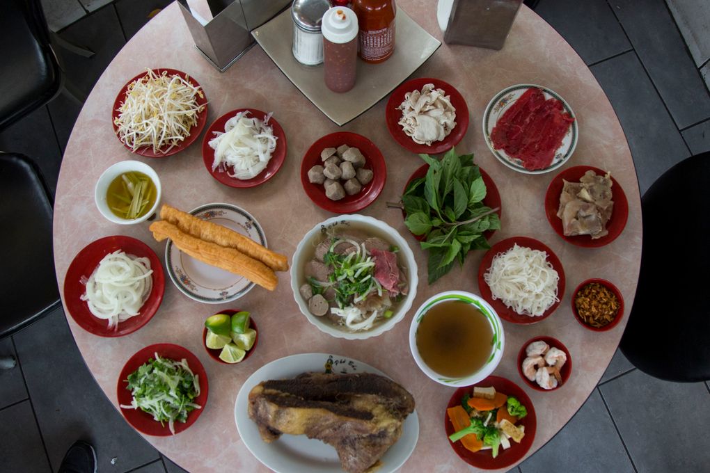 Ingredients and other go-alongs for pho at Pho Bac in Seattle. (Katie G. Cotterill / The Seattle Times)