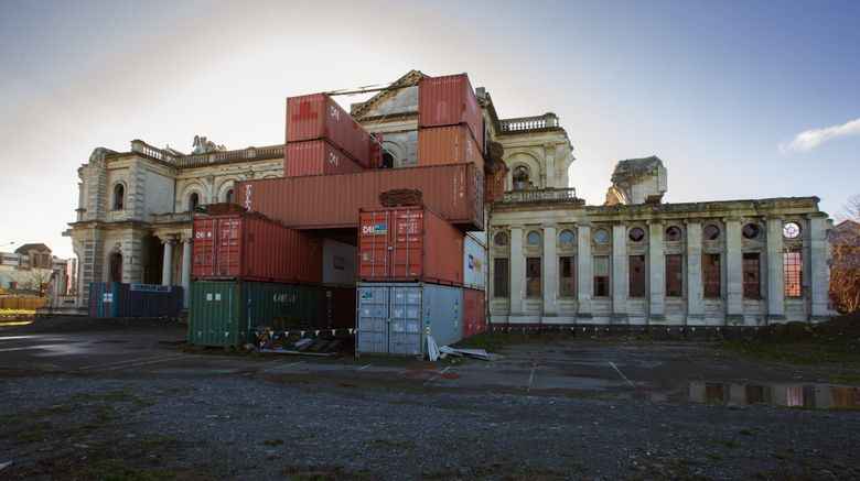 Shipping containers prop up the walls of the Cathedral of the Blessed Sacrament,  Christchurch’s Catholic cathedral. It was seriously damaged in the February 2011 earthquake, as was its Anglican counterpart, ChristChurch Cathedral. (Ellen M. Banner / The Seattle Times)