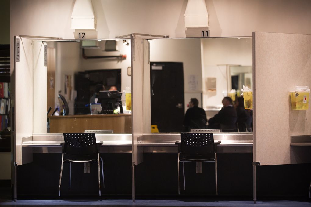 Insite provides private injection stations and sterile supplies. Several hundred drug users visit each day. The booths are disinfected between visits. (Lindsey Wasson/The Seattle Times)