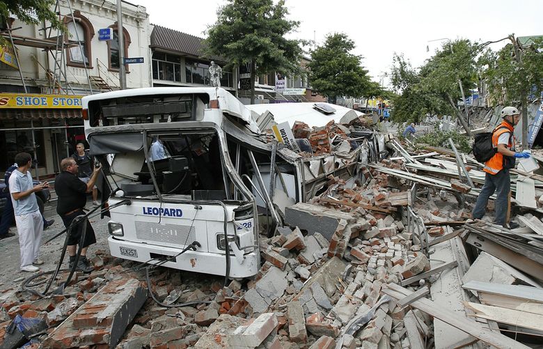 CHRISTCHURCH, NEW ZEALAND – FEBRUARY 23: Bus covered in building debris on February 23, 2011 in Christchurch, New Zealand. The 6.3 magnitude earthquake – an aftershock of the 7.1 magnitude quake on September 4 – struck 20km southeast of Christchurch at around 1pm local time, with initial reports suggesting damage and fatalities far exceeding the initial quake.  (Photo by Martin Hunter/Getty Images) 109335576