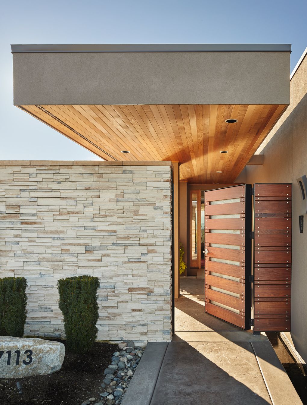 The entry gate is 2,000 pounds of solid metal with sandwiched ipe and glass, Houck says. “It was Darrin’s idea to make the overhang floating,” Larry says. “He came up with ideas, and we liked them. He said, ‘I didn’t think you’d do them all.’ ” (Benjamin Benschneider/The Seattle Times)