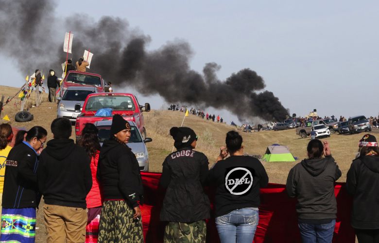 As tires burn on the front line of the protest on Hwy 1806, opponents of the oil pipeline line on Thursday.DAPL controversy and protests in North Dakota on Thursday, Oct 28, 2016