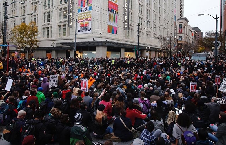 Black Lives Matter protesters march through Seattle on crowded shopping ...