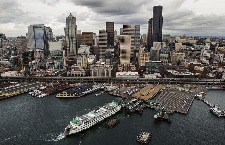 Colman Dock is seen below in this aerial view of Seattle on Nov. 11, 2015. ferry, seattle skyline  0435613298