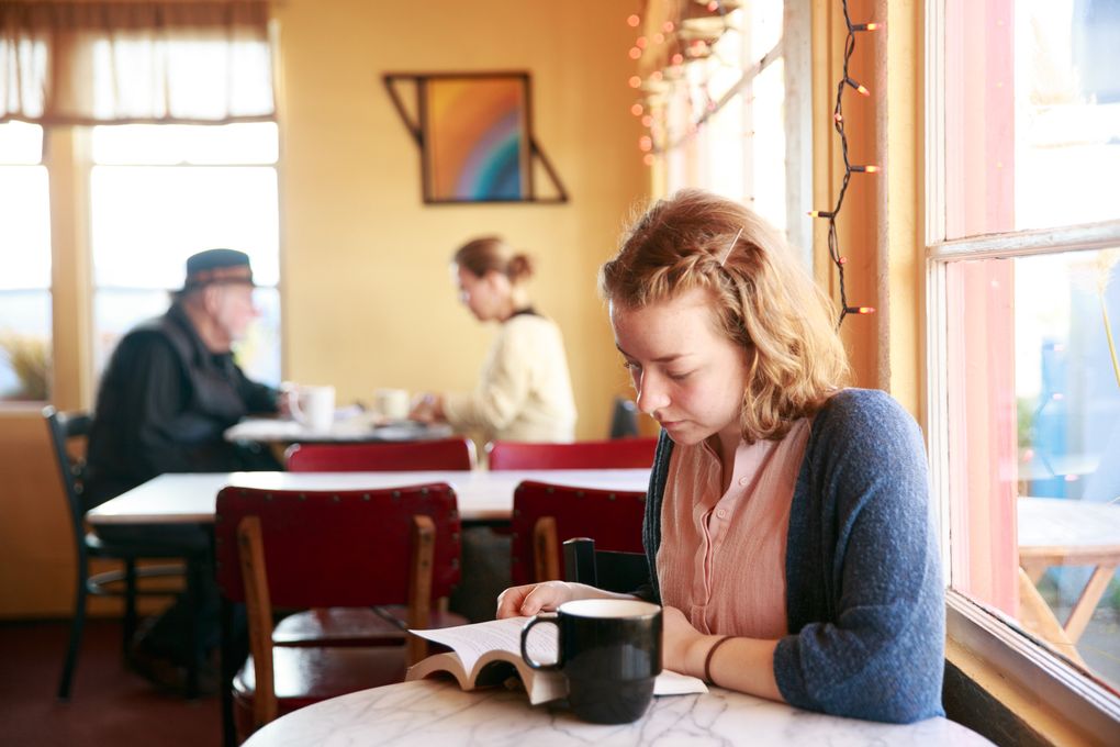 Ruthie Bryant relaxes at Poulsbohemian Coffeehouse. The shop was named Washington state’s best coffeehouse by Mentalfloss.com, which noted Poulsbohemian’s stunning view of Liberty Bay. (Erika Schultz/The Seattle Times)