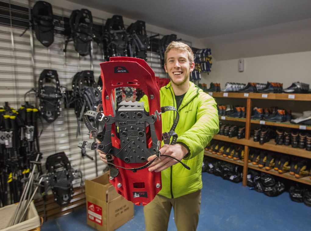 Peter Riewald runs the rental shop at Whittaker Mountaineering, which rents tire chains, cross-country gear and of course, snowshoes. (Steve Ringman/The Seattle Times)