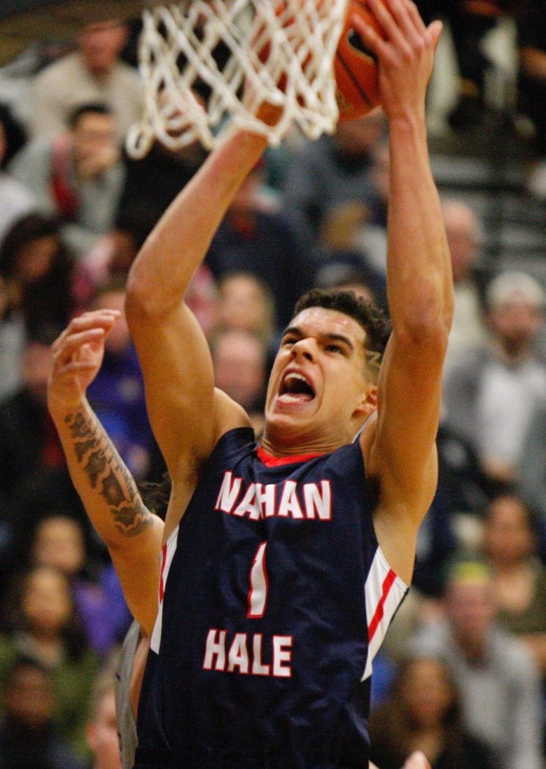Nathan Hale’s Michael Porter rises for a slam against Garfield.  (Photo courtesy of Norm Maves)