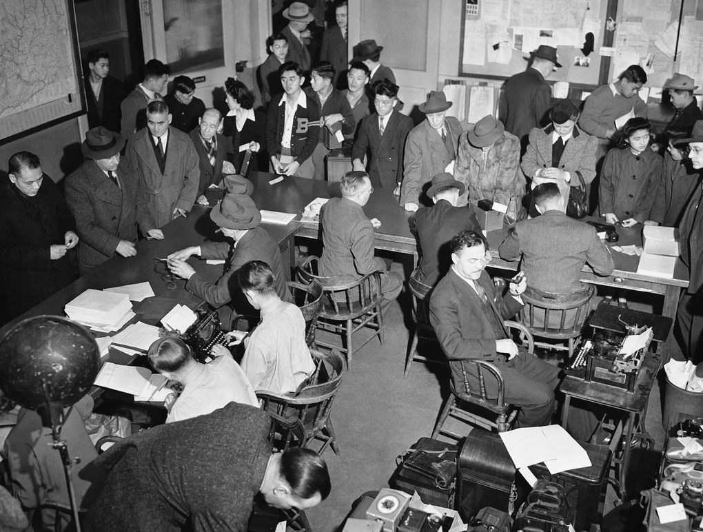 People of Japanese heritage forfeit cameras and radios with shortwave attachments on Dec. 27, 1941, in Seattle. (AP)
