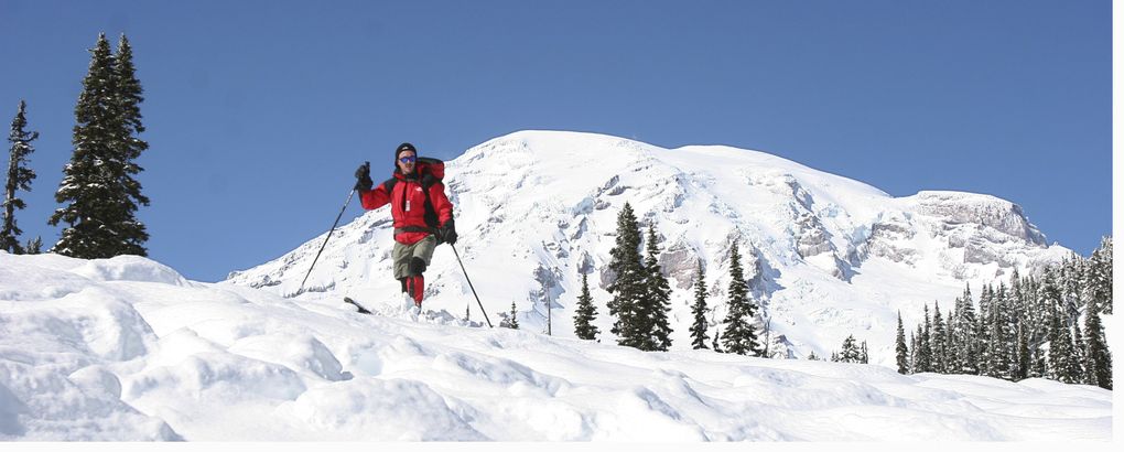 The Paradise area of Mount Rainier National Park is a playground for snowshoers and backcountry skiers when snow piles up and the sun comes out. (Mike Siegel/The Seattle Times archive)