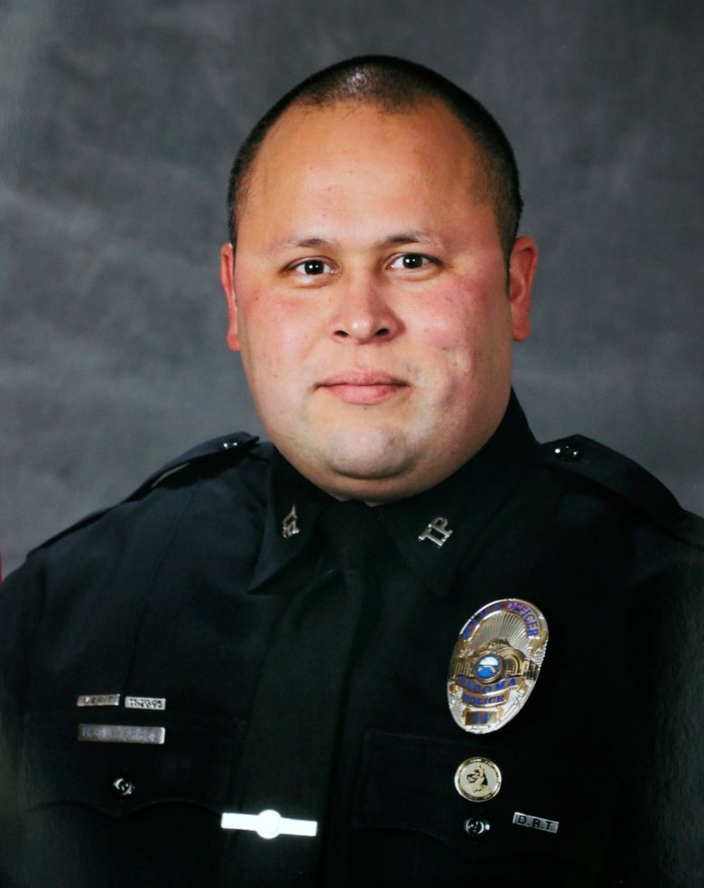 This undated photo provided by the Tacoma Police Department shows officer Reginald “Jake” Gutierrez, who was shot and killed while responding to a domestic violence call Wednesday, Nov. 30, 2016, in Tacoma, Wash.  Gutierrez, had served with the department since 1999 and was highly respected and experienced, Tacoma Police Chief Donald Ramsdell said Thursday, Dec. 1, 2016. (Tacoma Police Department via AP)