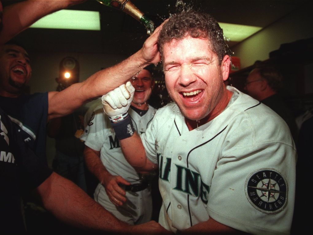 Edgar Martinez gets a champagne drenching in the Mariners locker room after his game-winning RBI in the bottom of the 11th inning in the division series against the Yankees on Oct. 11, 1995. (Rod Mar / The Seattle Times)