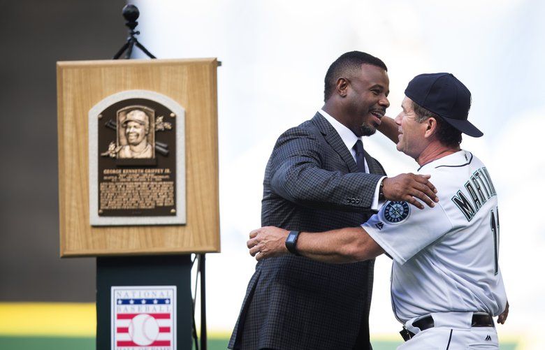 Baseball Hall of Famer Vladimir Guerrero, right, hugs Washington