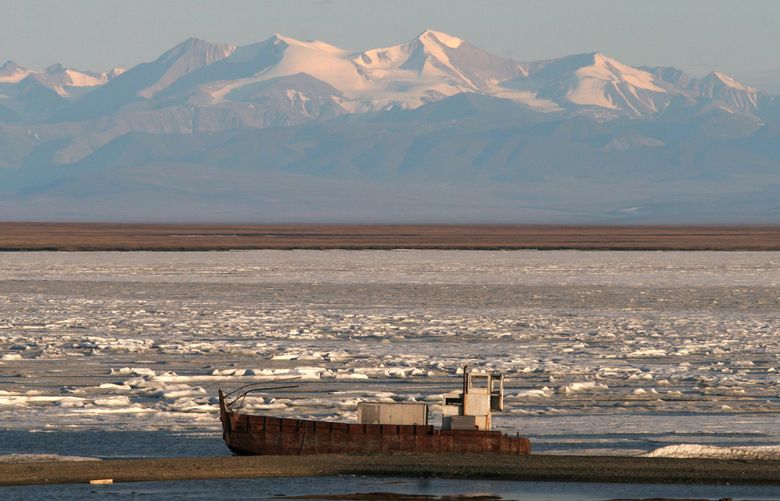 Cecil Andrus, who died Wednesday, helped pass legislation to set aside an area in Alaska the size of California as national parks, national forests and refuge areas, including the Arctic National Wildlife Refuge, seen above. Here the Brooks Range towers in the background above the coastal plain of the refuge. (The Associated Press, file)