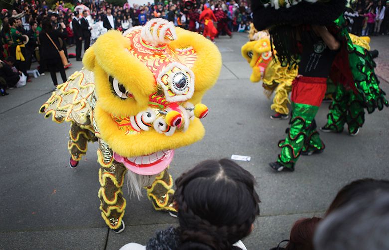 145220 — VIETNAMESE NEW YEAR– 02/22/2015
A lion from the GDPT Van Hanh and Mak Fai dance teams circles towards onlookers at Fisher Pavilion during Tet in Seattle, a Vietnamese Lunar New Year celebration, at Seattle Center on Sunday, Feb. 22, 2015. Part of Seattle Center’s Festal series, the two-day event featured lion dances; live martial arts, dance and opera performances; a spelling bee and a knowledge bowl competition. The official Vietnamese New Year national holiday was celebrated on Feb. 19 and traditionally marks the first day of spring.