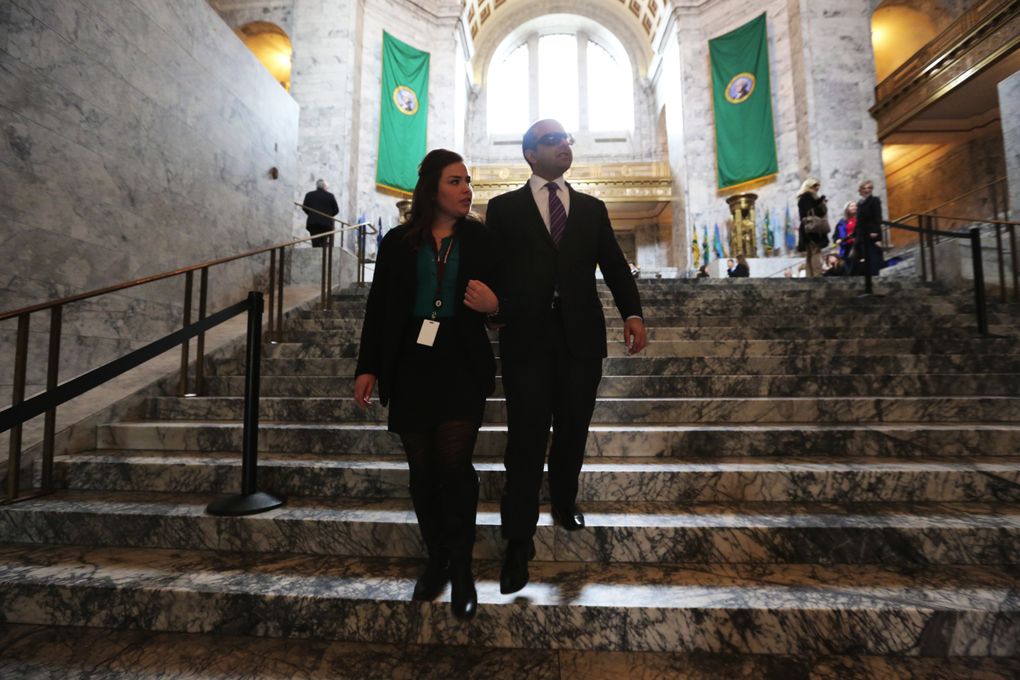 Lt. Gov. Cyrus Habib’s communications director, Keeley Smith, walks with him to his office in the Capitol. (Alan Berner/The Seattle Times)