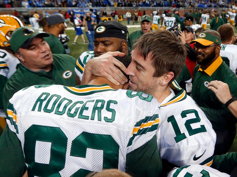 Jeff Janis holds up ball after Hail Mary catch, AP photo