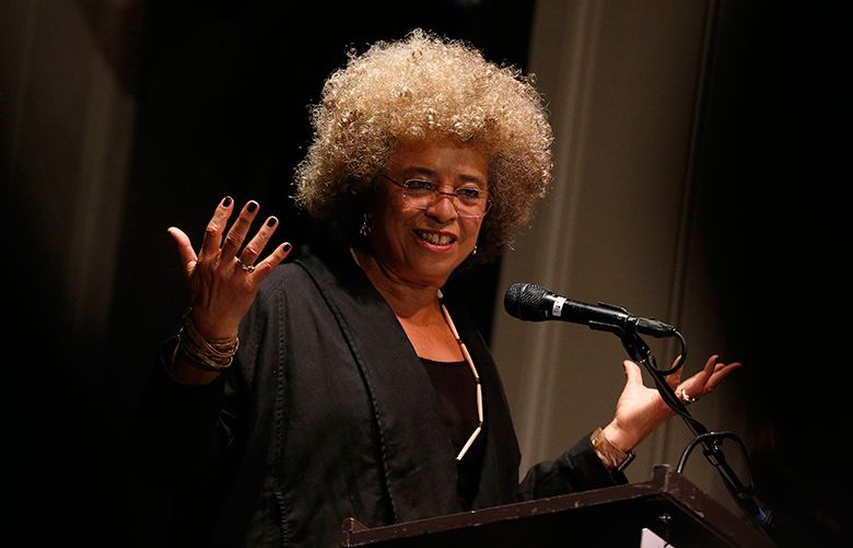 American political activist Angela Davis  speaks to a sold out crowd during the 3rd annual MLK Unity Day event held at Town Hall Seattle on Thursday, January 12, 2017. The event, which is dedicated to commemorating Martin Luther King Jr., brought in city officials such as Mayor Ed Murray, Council President Bruce A. Harrell as well as members of the Seattle City Council.