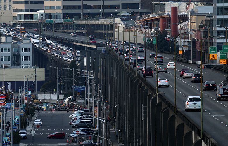 (This is for the Magazine) Looking north from atop an apartment building on W. Main St., the congested southbound Viaduct traffic drops down to the lower decking, Tuesday, Jan. 24, 2017, in Seattle.