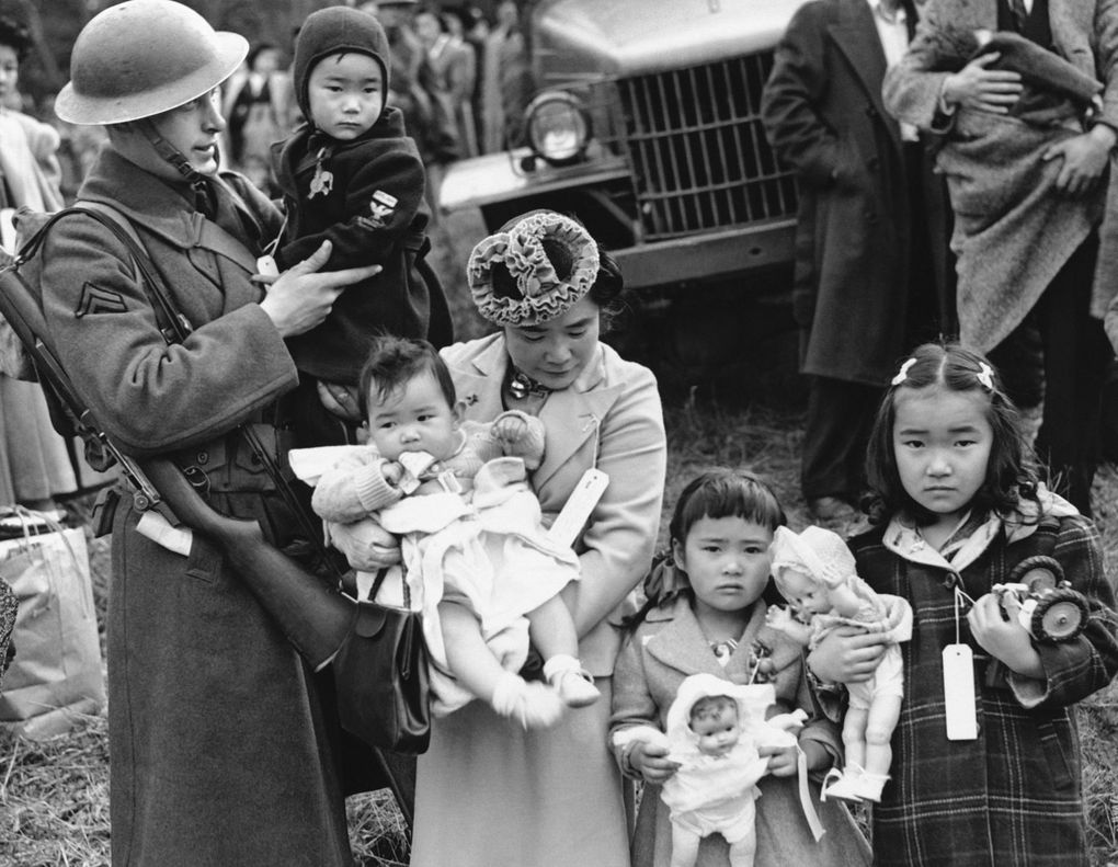 Shigeho Kitamoto and her children are forced to leave their Bainbridge Island home in 1942. (AP)