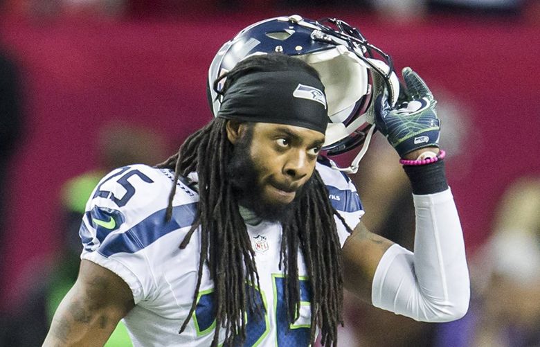 Seahawks cornerback Richard Sherman walks back to the bench after Falcons wide receiver Julio Jones scored in the second quarter as the Seattle Seahawks take on the Atlanta Falcons at the Georgia Dome in Atlanta for an NFC playoff game Saturday January 14, 2017.