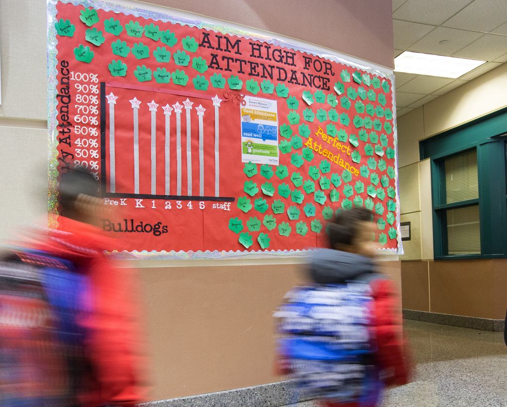 This chart in the main hallway of Manitou Park Elementary shows attendance results for each grade and the staff. (Mike Siegel/The Seattle Times)