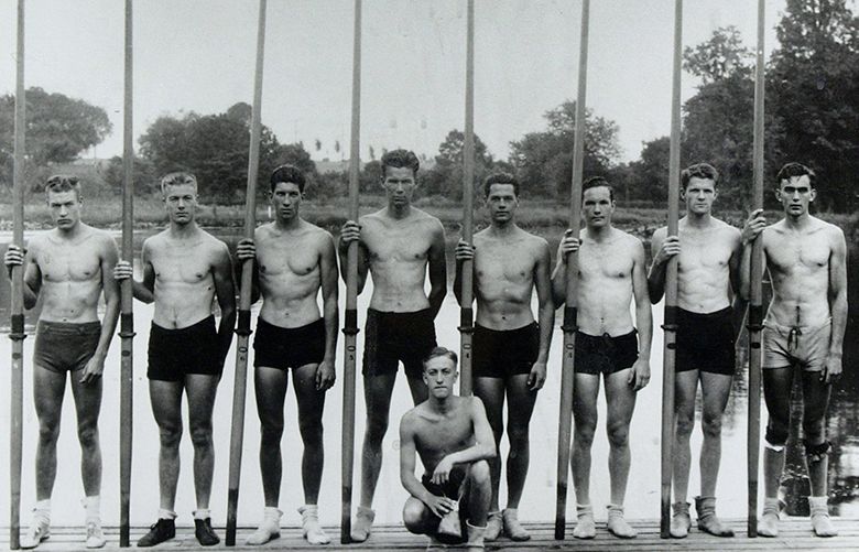 Boys in the Boat050504 – SEATTLE – The University of Washington Men’s 8 that won the Gold medal in the 1936 Olympics in Berlin, Germany are pictured in this undated photo.  Standing, from left, Don Hume, Joe Rantz, George Hunt, Jim McMillin (cq), John White, Gordon Adam, Charles Day and Roger Morris. Kneeling in front is Bob Moch, coxswain.

crew