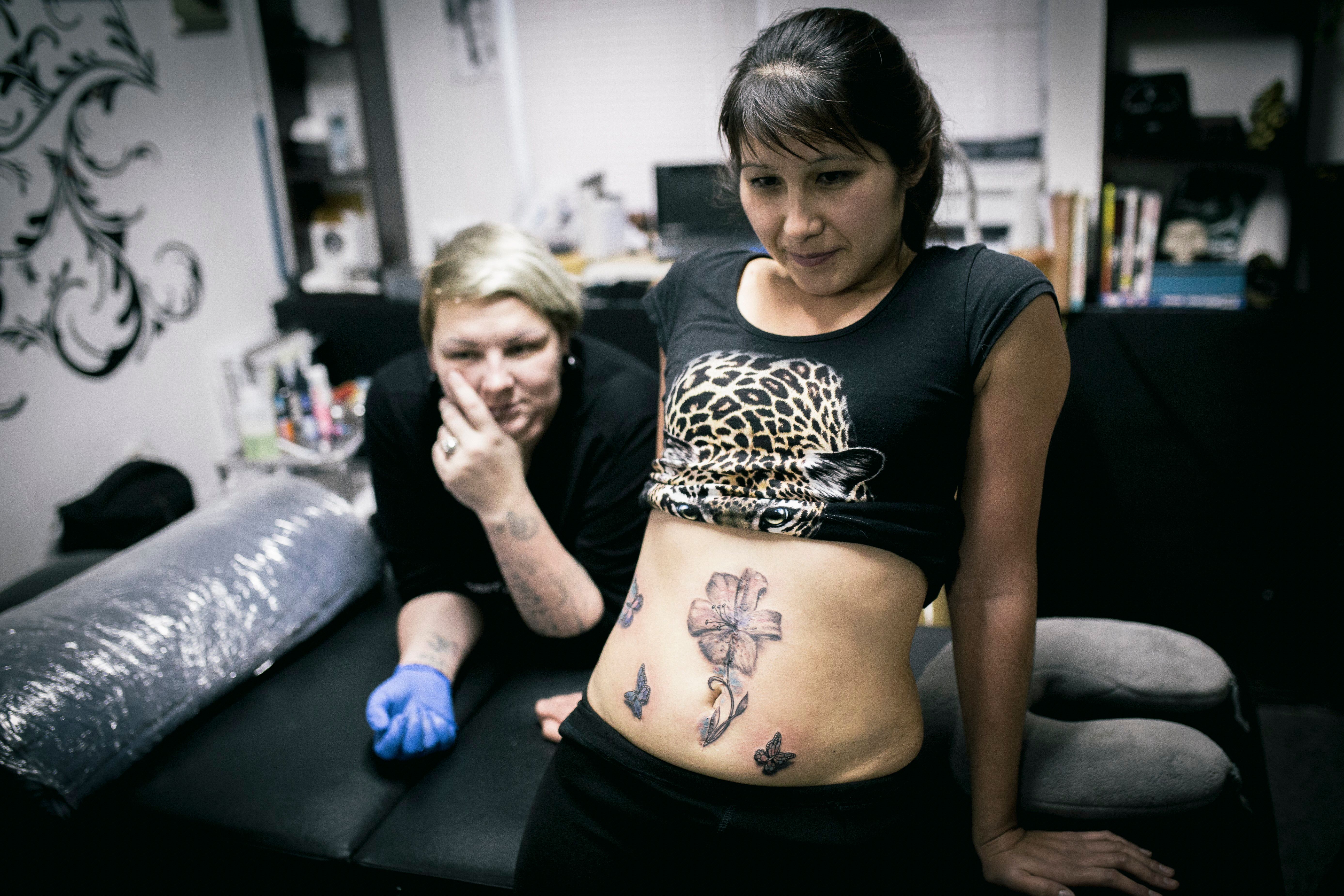 Woman gets illusion 'internal void' tattoo – but everyone is distracted by  something else | The US Sun