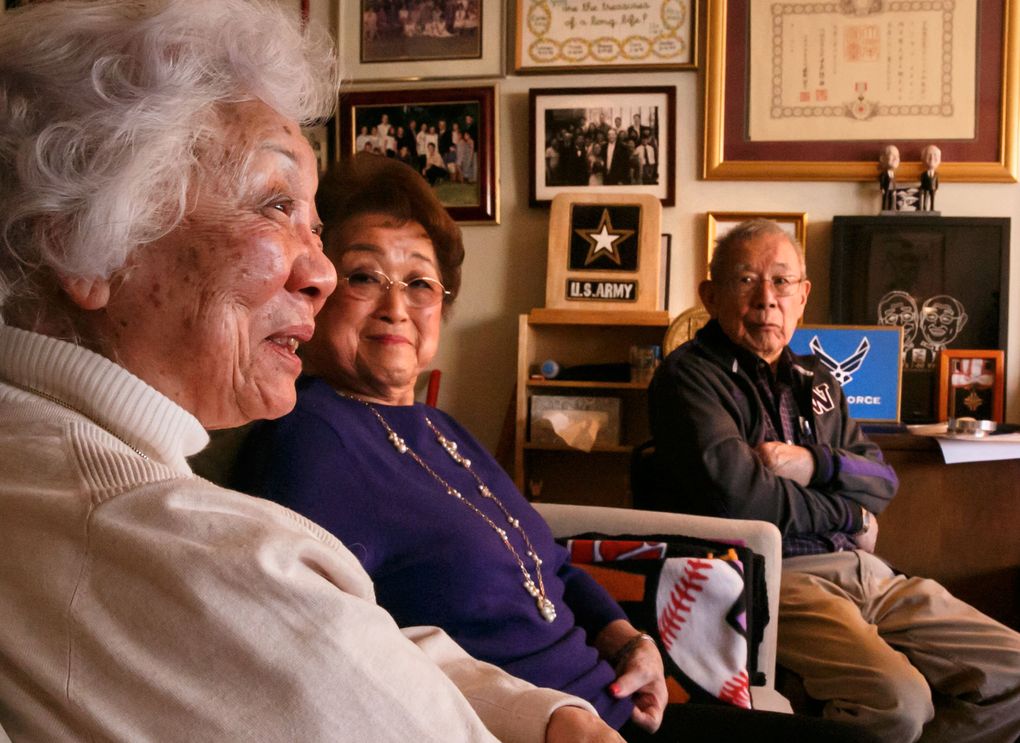 Marianne Tada, 82, left, Louise Kashino-Takisaki, 90, and Tosh Okamoto, 90, talk in Seattle about living in internment camps. (Erika Schultz/The Seattle Times)