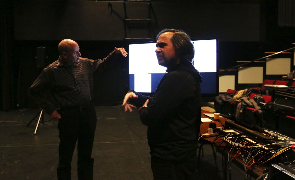 DXARTS co-founders Richard Karpen, left, and Juan Pampin discuss the musicians’ brain waves during a rehearsal on the UW campus in Meany Studio Theater. (Alan Berner/The Seattle Times)