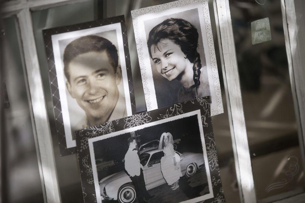 Old photos of Sally Steiner, right, and her husband Joe Steiner Sr. hang up in the Quarter Chute Cafe, which they own and operate at Emerald Downs. (Bettina Hansen/The Seattle Times)