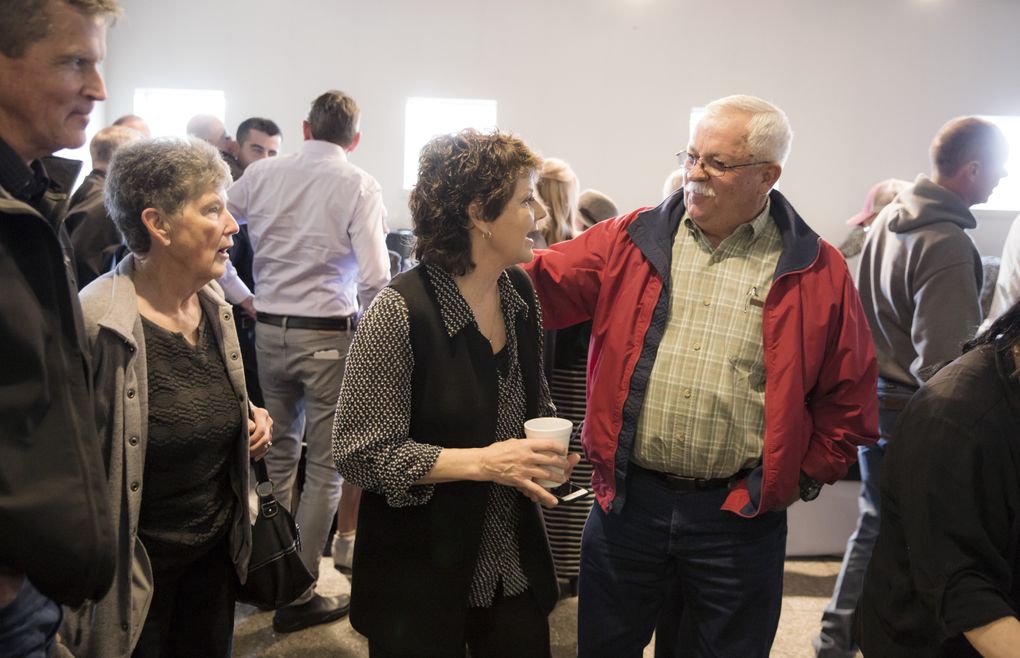 Kay Cooper, horse trainer and daughter of fellow trainer Jim Penney, is greeted by Shorty Martin, right, at her father’s memorial service at the Washington Thoroughbred Breeders and Owners Association building at Emerald Downs. Penney, a beloved and decorated horse trainer, passed away in February 2017 in his home at age 82. Martin said he had known Penney for his whole life – he started working for him at age 15 as a groom and later on a barn foreman. Over 100 members of the horse racing community came to pay their respects to Penney, who trained five winners of the Longacres Mile in his career. (Bettina Hansen/The Seattle Times)