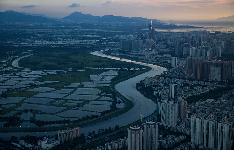 A view of Shenzhen, China, from the KK100 tower, June 21, 2016. Shenzhen was transformed in a few decades from a small fishing village into a city of millions. In the Pearl River Delta, breakneck development is colliding with the effects of climate change. (Josh Haner/The New York Times)