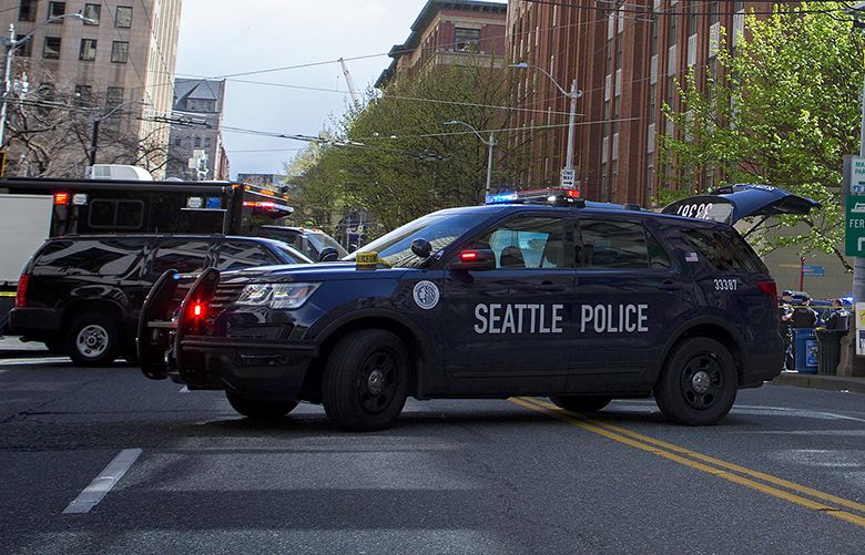 Cop wounded in Seattle shoot-out released from hospital | The Seattle Times