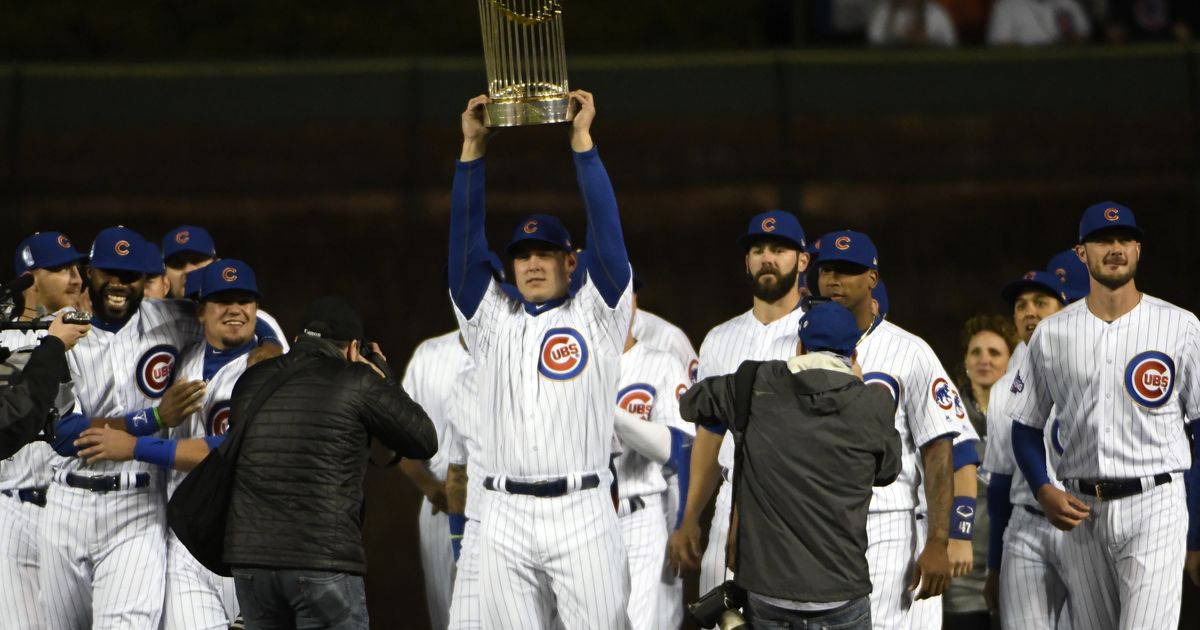 Kris Bryant holding the World Series trophy at the Chicago Cubs