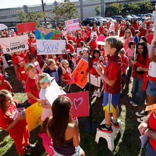 A student speaks as parents and others rally before the school board meeting to protest against two school closure proposals in Seattle on Wednesday, September 18, 2024. The rally is organized by All Together for Seattle Schools.