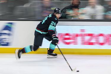 Seattle Kraken defenseman Jamie Oleksiak controls the puck in the third period of the home opener Tuesday afternoon in Seattle, Washington, on October 8, 2024. The Kraken lost 3-2.