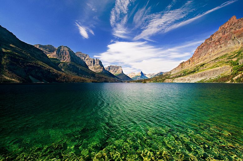 Glacier National Park  brims with world-class lakes, peaks, vistas and more than 700 miles of trails to explore.