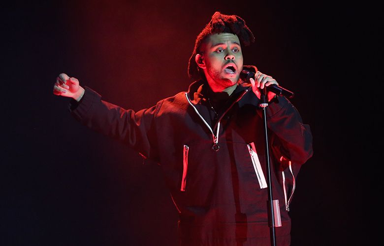 FILE – In this April 7, 2016, file photo, The Weeknd performs during the 2016 Echo Music Award ceremony in Berlin. Kanye West and The Weeknd will headline the first edition of the Meadows Music and Arts Festival in October 2016 in New York City. (AP Photo/Markus Schreiber, Pool, File)