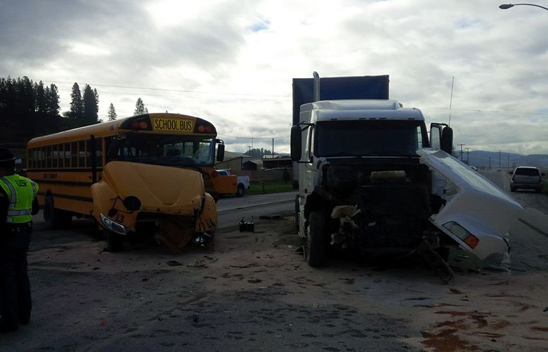 Semi collides with school bus; driver, student hurt | The Seattle Times